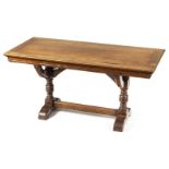 *Library Table. Victorian mahogany Gothic revival library table, the rectangular top above curved