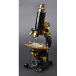 *Microscope. A black enamelled and lacquered brass compound monocular microscope by W. Watson & Sons