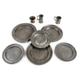 *Pewter. A mixed collection of pewter ware, including 2 large 18th century circular serving