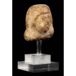 *Ancient Egypt. 19/20th Dynasty, small carved alabaster head of a male figure, wearing duplex wig