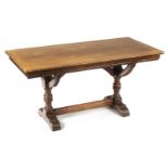 *Library Table. Victorian mahogany Gothic revival library table, the rectangular top above curved