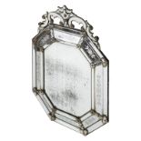 *Mirror. 19th century Venetian mirror, of octagonal form with mirrored framed, the crest with