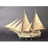 * Model Ship. Wooden scale model ship, with two fully rigged masts, deck fittings and white and ...