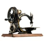 * Sewing machine. A late 19th century sewing machine by Willcox & Gibbs circa 1880