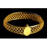 * Bangle. A Continental 18ct gold ladies bangle