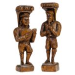 * Oak figures. A pair of carved oak figures playing musical instruments