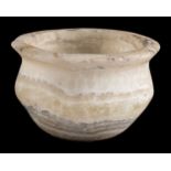 * Alabaster Vessel. A Mesopotamian alabaster hand-carved vessel