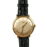 * Longines. A gentleman's Longines Automatic 18K gold wristwatch