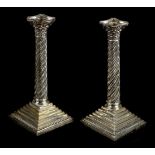 * Candlesticks. A pair of Victorian silver Corinthian column candlesticks by H.F., London, 1891