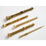 * Gold Pencils. A collection of 5 Victorian yellow metal propelling pencils