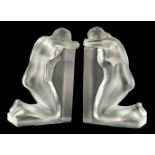 * Lalique (Rene, 1860-1945). A pair of Lalique glass bookends in the form of a kneeling female nude