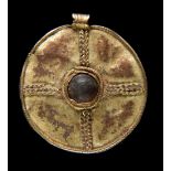 * Anglo Saxon Pendant. An Anglo Saxon copper gilt pendant, 6th or 7th century A.D.