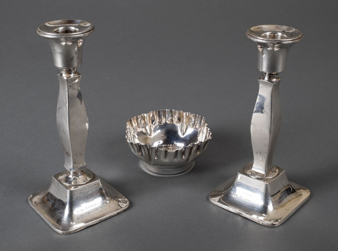 * Mixed silver. A pair of silver candlesticks and bowl
