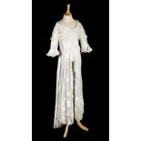 * Dress. An appliquéd white muslin overdress, circa 1910