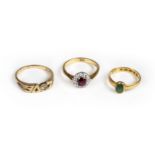 * Rings. A 22ct gold ring set with a green stone cabochon and 2 others