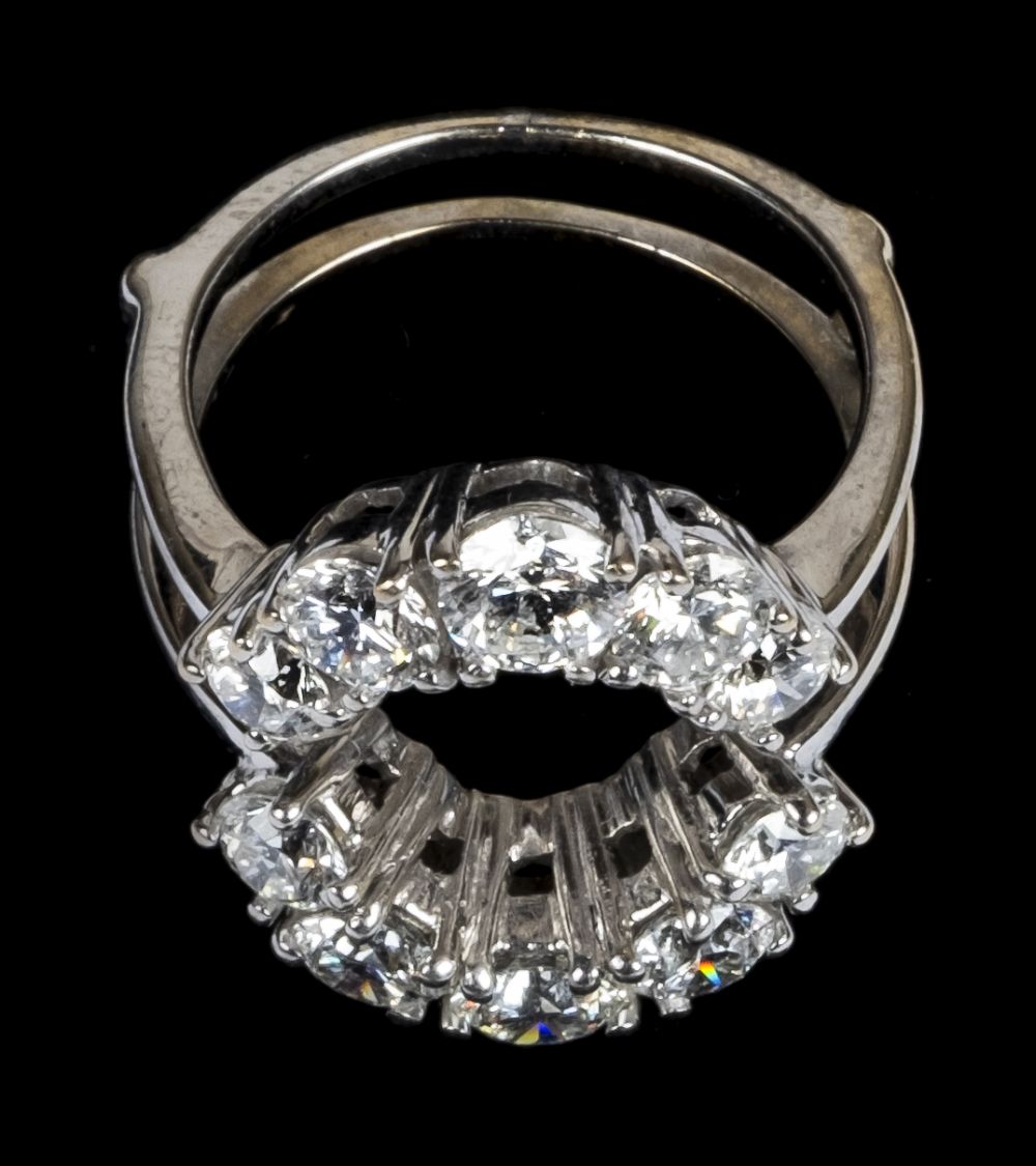 * Ring. An 18ct white gold jacket ring set with 10 brilliant cut diamonds