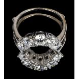 * Ring. An 18ct white gold jacket ring set with 10 brilliant cut diamonds
