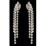 * Earrings. A pair of ladies 18K white gold diamond drop earrings
