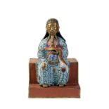 CLOISONNE FIGURE OF A SEATED OFFICIAL, LATE QING DYNASTY, modelled seated on a stepped base and