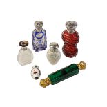 COLLECTION OF VICTORIAN AND LATER SCENT BOTTLES, comprising a cranberry cut glass and silver top