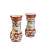 A PAIR OF KUTANI VASES, circa 1900, of flaring baluster form decorated with cartouches of a