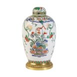 CHINESE FAMILLE ROSE COVERED JAR WITH GILT-BRONZE MOUNTS, 19TH CENTURY, the sides painted with