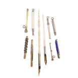 COLLECTION OF PROPELLING PENCILS AND DIP PENS, 19th century and later, comprising two yellow metal