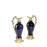 PAIR OF CHINESE BLUE-GROUND AND GILT-BRONZE MOUNTED EWERS, 18TH / 19TH CENTURY, the baluster vases