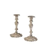 PAIR OF GEORGE II CAST SILVER CANDLESTICKS by John Cafe, London 1746/1747, with associated