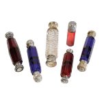 COLLECTION OF VICTORIAN AND LATER GLASS SCENT BOTTLES, comprising three silver topped cranberry