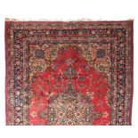 A GOOD MASHED CARPET, all-over design in red and blue, large central motif within a five row border.