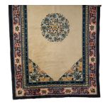 A CHINESE WOOL RUG, beige ground, centre circular motif, blue border. 152.5cm x 244cm