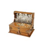 VICTORIAN OAK AND SILVER PLATED TANTALUS AND GAMES COMPENDIUM, the mirrored back with bevelled edge,