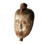 20TH CENTURY WEST AFRICAN CARVED AND PAINTED WOODEN MASK YAURE