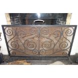 A BLACKSMITH MADE WROUGHT IRON SPARK GUARD