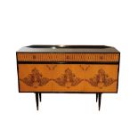 G.W. EVANS FOR ROBERT HERITAGE: AN EBONISED AND ASH CREDENZA