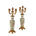 PAIR OF GILT BRONZE MOUNTED CHINESE FAMILLE VERTE CANDELABRA