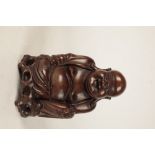CARVED HARDWOOD FIGURE OF A LAUGHING BUDDHA