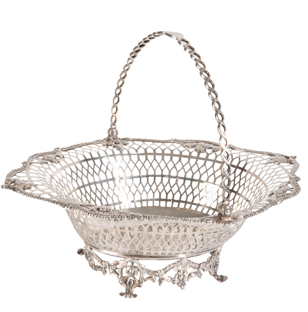 GEORGE III IRISH SILVER SWING-HANDLED CAKE BASKET