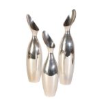 IN THE MANNER OF GEORG JENSEN: A SET OF THREE GRADUATED SILVER VASES