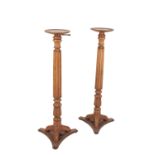 A PAIR OF GEORGE III STYLE TORCHERE