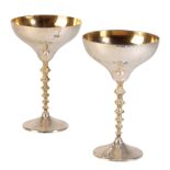 •STUART DEVLIN: A PAIR OF SILVER PARCEL-GILT GOBLETS