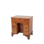 GEORGE I WALNUT AND FEATHERBANDED KNEE HOLE DESK