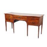 GEORGE III SHERATON STYLE FLAME-MAHOGANY SERPENTINE SIDEBOARD