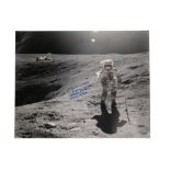 A photograph taken from the Apollo 16 mission showing Charlie Duke next to the Plum Crater