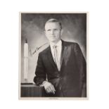 Frank Borman, an official signed business suit black and white litho photograph