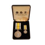 A CASED SPINKS BRUNEI GURKHA RESERVE MEDAL AND MINIATURE