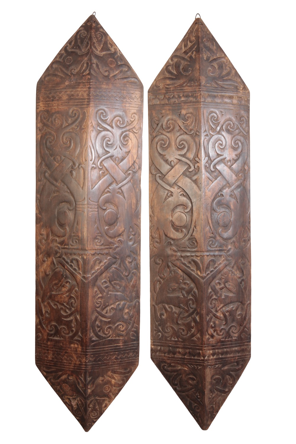 CARVED WOOD DAYAK SHIELDS FROM A LONGHOUSE ENTRANCE