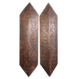 CARVED WOOD DAYAK SHIELDS FROM A LONGHOUSE ENTRANCE