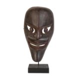 BATAK FINELY CARVED WOODEN MASK ON STAND